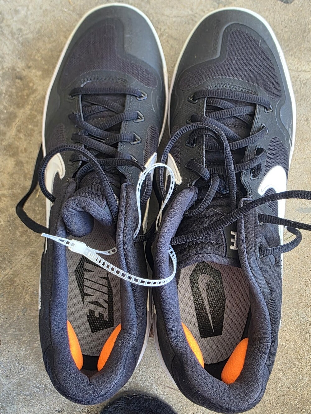 Nike Men’s Black and White Athletic Shoes with Orange Heel Tabs